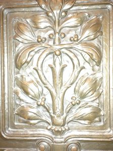 Part of a door with a wonderful design on it.