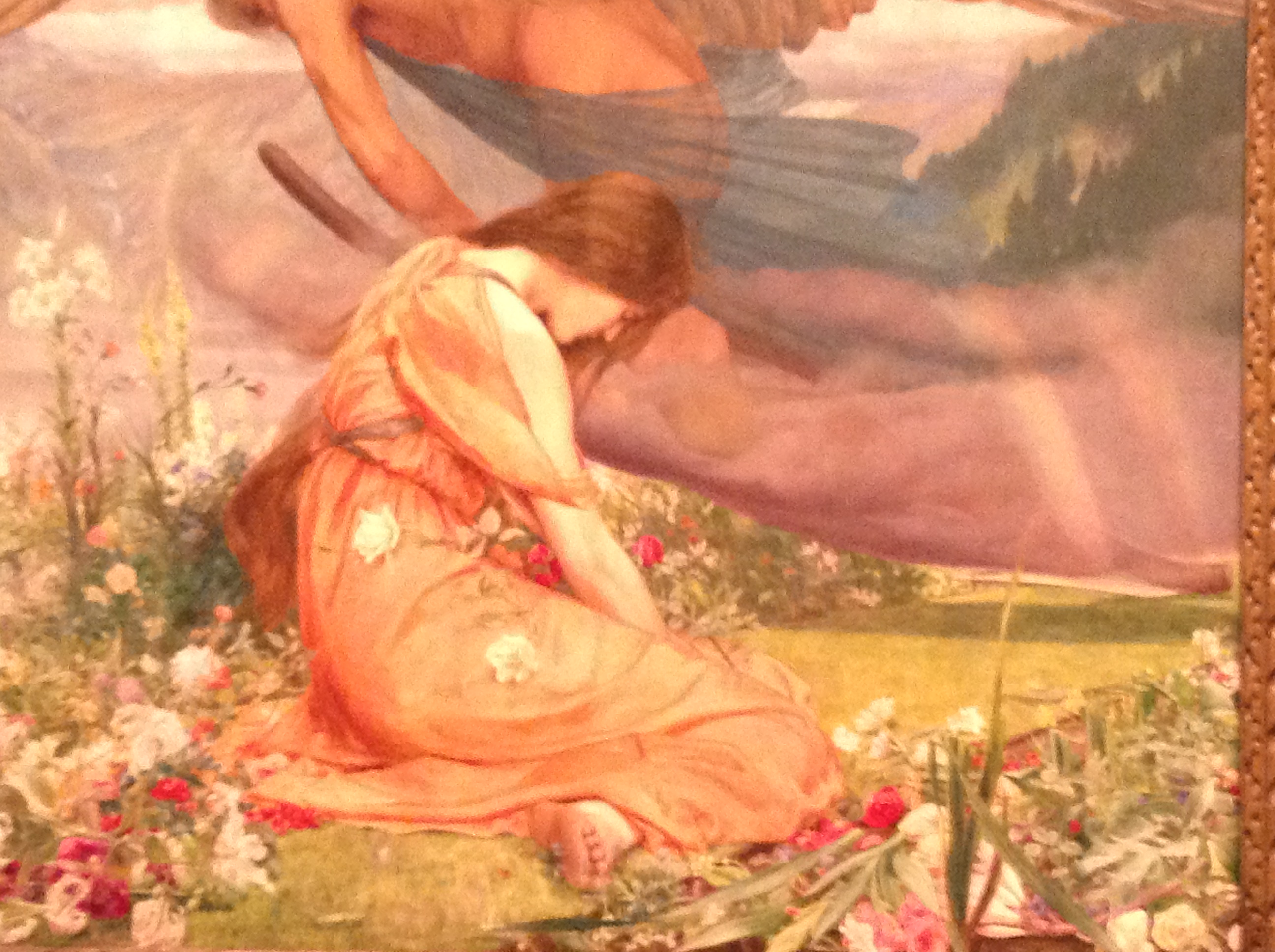 A woman sitting in a bright meadow.
