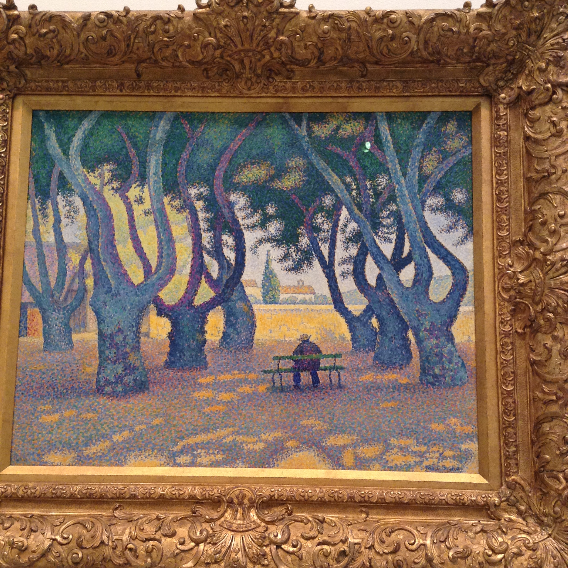 A painting of a man sitting on a park bench facing away in the park.